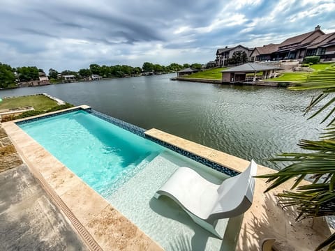 Enjoy peaceful lakeside views from the private pool or cast your fishing line from the backyard!