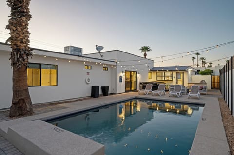 Relax in your own sparkling pool under palm trees