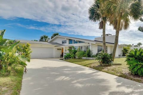 You've made it to paradise! This is your welcoming view into our double wide drive, and simple white beach house on a quiet cul-de-sac.