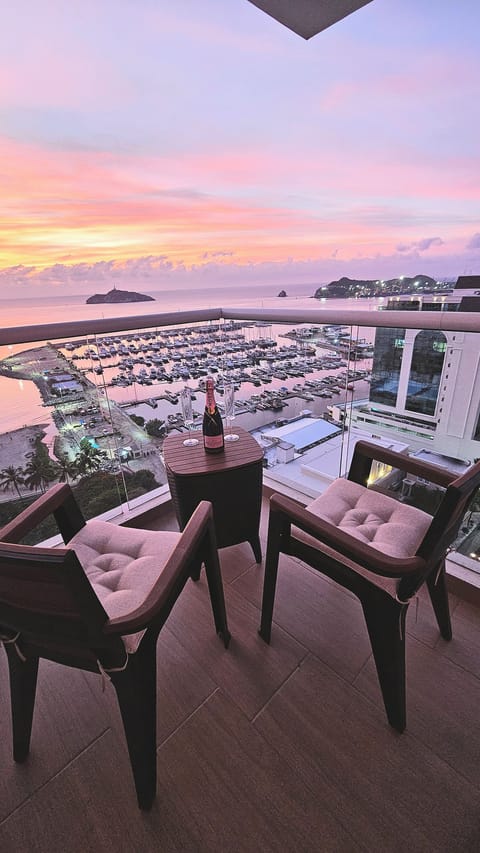 The bedroom's private balcony, a cozy space for amazing views and nice drinks!