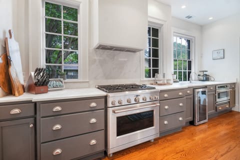 Large chef kitchen with stainless steel appliances - gas stove