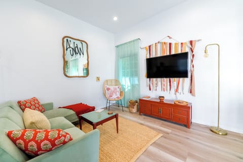Spacious lounge area with high ceiling.