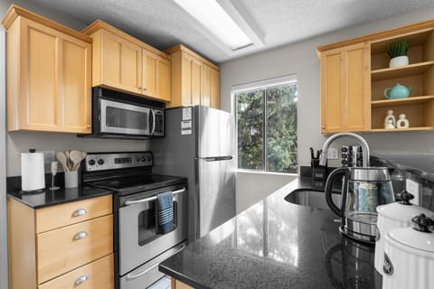 Fully stocked kitchen and coffee station.