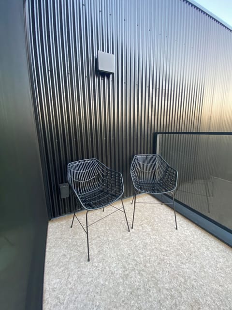 Balcony with glass railing and mountain views in winter
