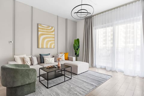 Bright living room w/ cozy seating & sunlit windows