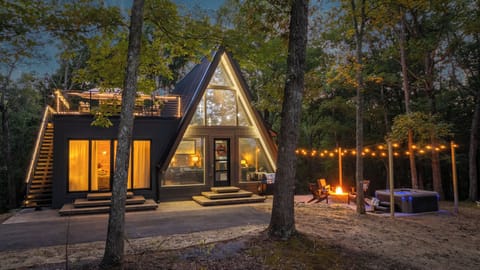 Your A-frame escape—hot tub, fire pit, and rooftop deck