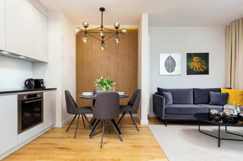 Relax in the stylish living room with a comfortable sofa and modern decor.