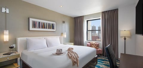 Relax into plush bedding with softly glowing bedside lighting.