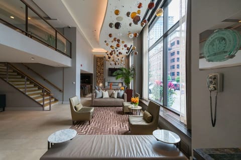 Unwind under shimmering pendant orbs in the airy lobby lounge
