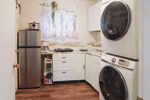 Kitchen equipped with essential appliances.
