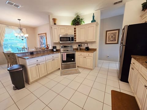 Cook with ease in the fully equipped kitchen, complete with modern appliances.