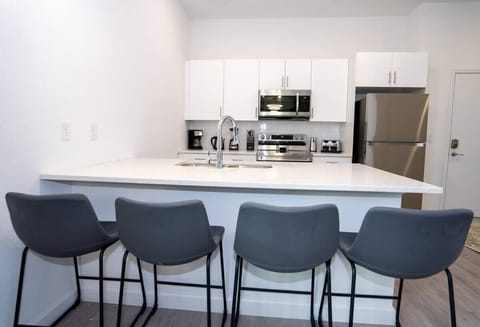 Fully stocked kitchen with modern appliances and all the essentials to cook at home.