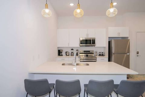 Fully stocked kitchen with modern appliances and all the essentials to cook at home.