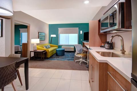 Settle in with a handy kitchenette for easy snacks anytime.