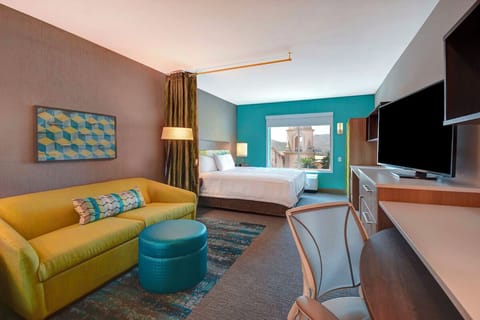 Stretch out in the spacious suite with sofa and work desk.