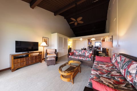 Stretch out in the airy living room under vaulted ceilings.