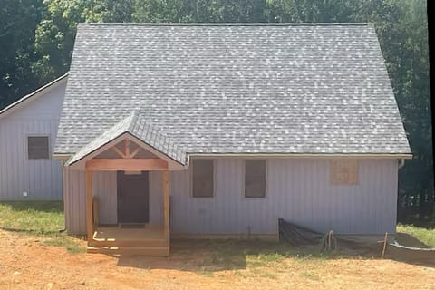Front of house - landscaping & driveway in process.