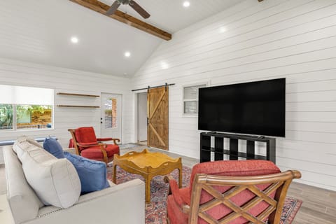 Bonus room.
Spacious wrap-around seating and 85" TV.