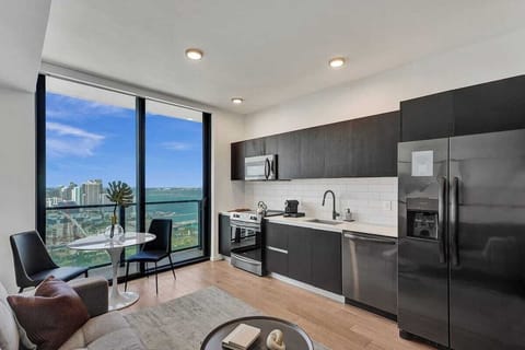 Open kitchen with sweeping bay and city views