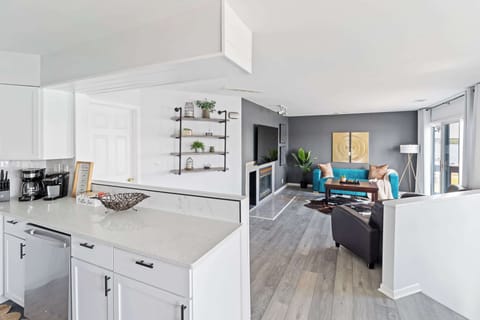 Modern kitchen angle highlighting clean cabinetry & practical layout.