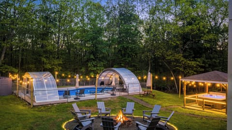 Your dream yard includes pool, hot tub gazebo & cozy fire pit!