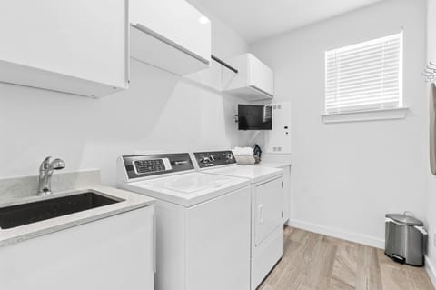 Convenient in-home laundry with washer, dryer, and utility sink—perfect for longer stays.