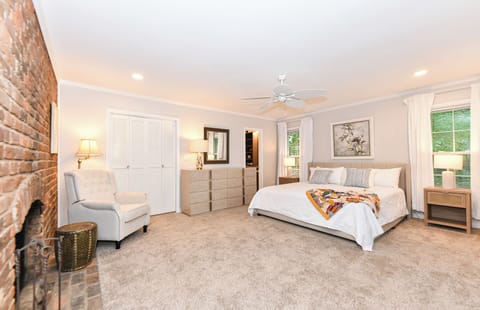 Primary bedroom with a king bed, full bath and a private deck off to the side
