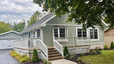 Wraparound front porch to enjoy your morning coffee with glimpses of Lake Huron