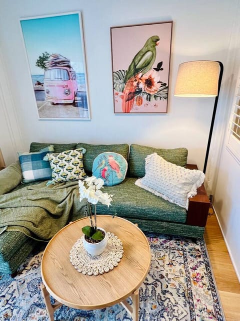 Spacious and cozy living room with comfortable seating, air conditioning, and a smart TV. Stylishly decorated and filled with natural light, it`s the perfect place to unwind and feel at home during your stay at McKenzi unit.