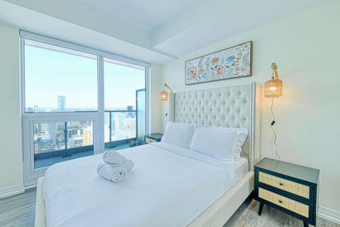 A comfortable queen bed and soft, inviting linens for a relaxing ambiance