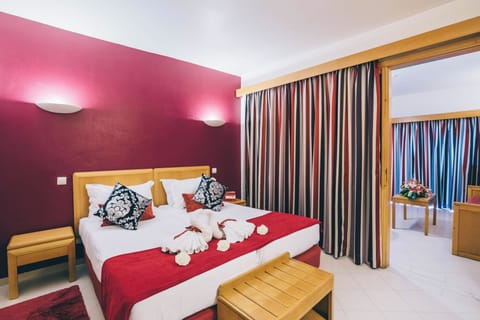 Relax in a spacious bedroom with inviting touches and light.