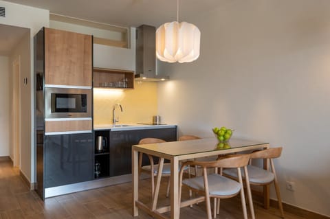 Cook effortlessly in the sleek kitchenette, then linger over dinner.