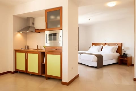 Prepare easy meals in the sleek kitchenette beside your bed.