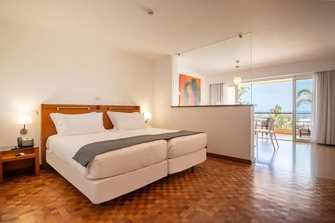 Unwind on plush beds and step out to sunny terrace views