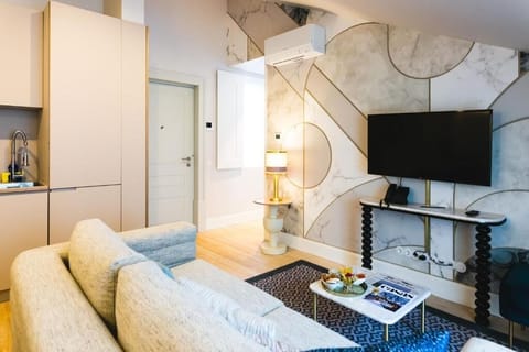 Unwind on the cozy sofa with TV and warm lighting.