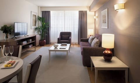 Relax in the spacious lounge with soft lighting and plush seating.