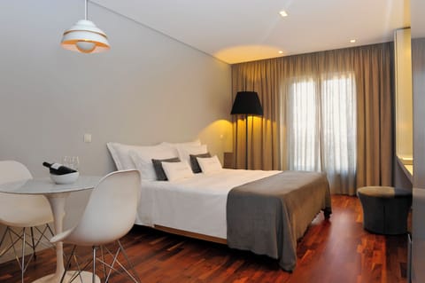 Sip morning coffee beside crisp linens and warm wood floors.