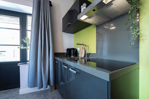 Comfortable stay with kitchenette, coffee corner, and big windows.