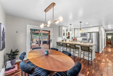 Elegant dining table for 6 + bar seating and walkout deck