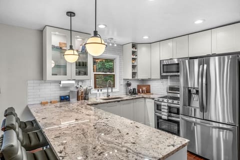 Fully equipped kitchen with bar seating