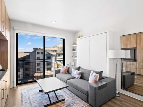 Studio living area with queen Murphy bed