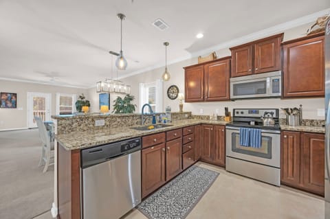 Fully equipped kitchen with stainless steel appliances.
