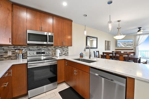 Modern kitchen featuring all stainless steel appliances