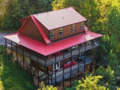 Escape to the mountains. This secluded cabin is nestled among lush greenery, offering the ultimate private retreat.