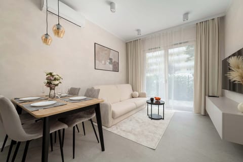 Relax in the stylish living room with a comfortable sofa and modern decor.