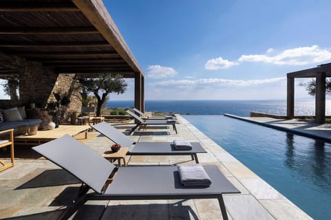 Enyalos's sleek infinity pool appears to merge with the sea.