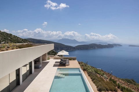 The geometric, contemporary lines of Oikos Nostos and views out over to neighbouring Meganissi.