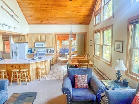 The living room is open to the kitchen and dining room