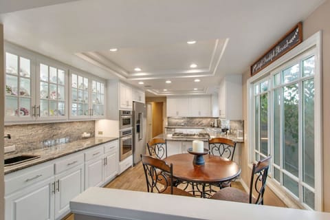 Start your day right in our cozy breakfast nook, adjacent to a fully equipped kitchen.