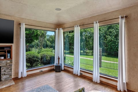 Gorgeous view of golf course and greenbelt from spacious living room